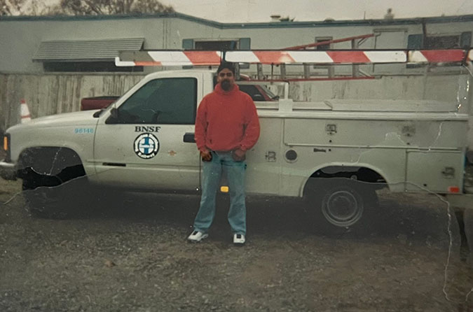 Chavez in front of a BNSF work truck circa 2000 in Denair, California