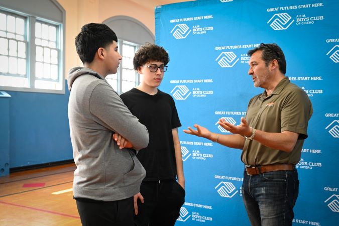 Peter Skosey, executive director, Public Affairs, chats with club members. 